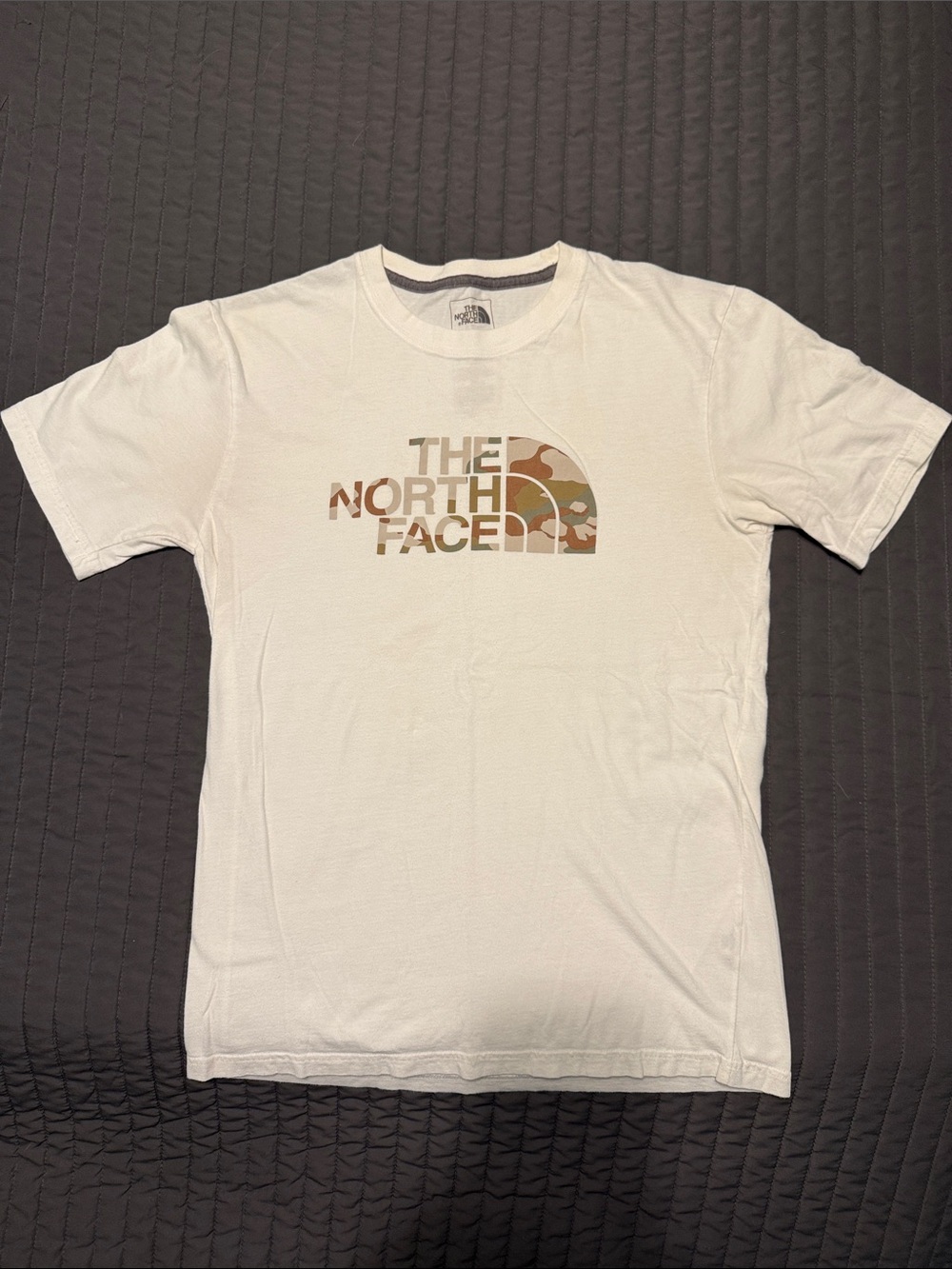 The North Face Men’s White Tee with Tan Camo Logo